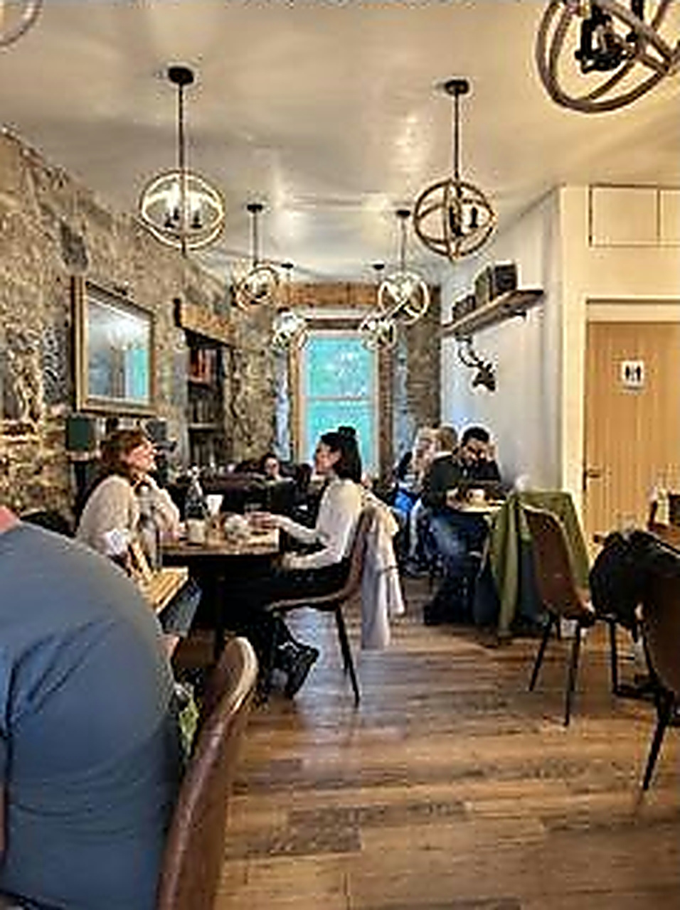 Guests enjoying the stone-walled reading room