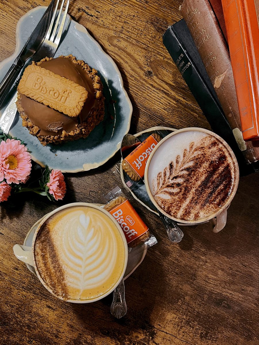 Biscoff bake, a latte and a paperback, from above
