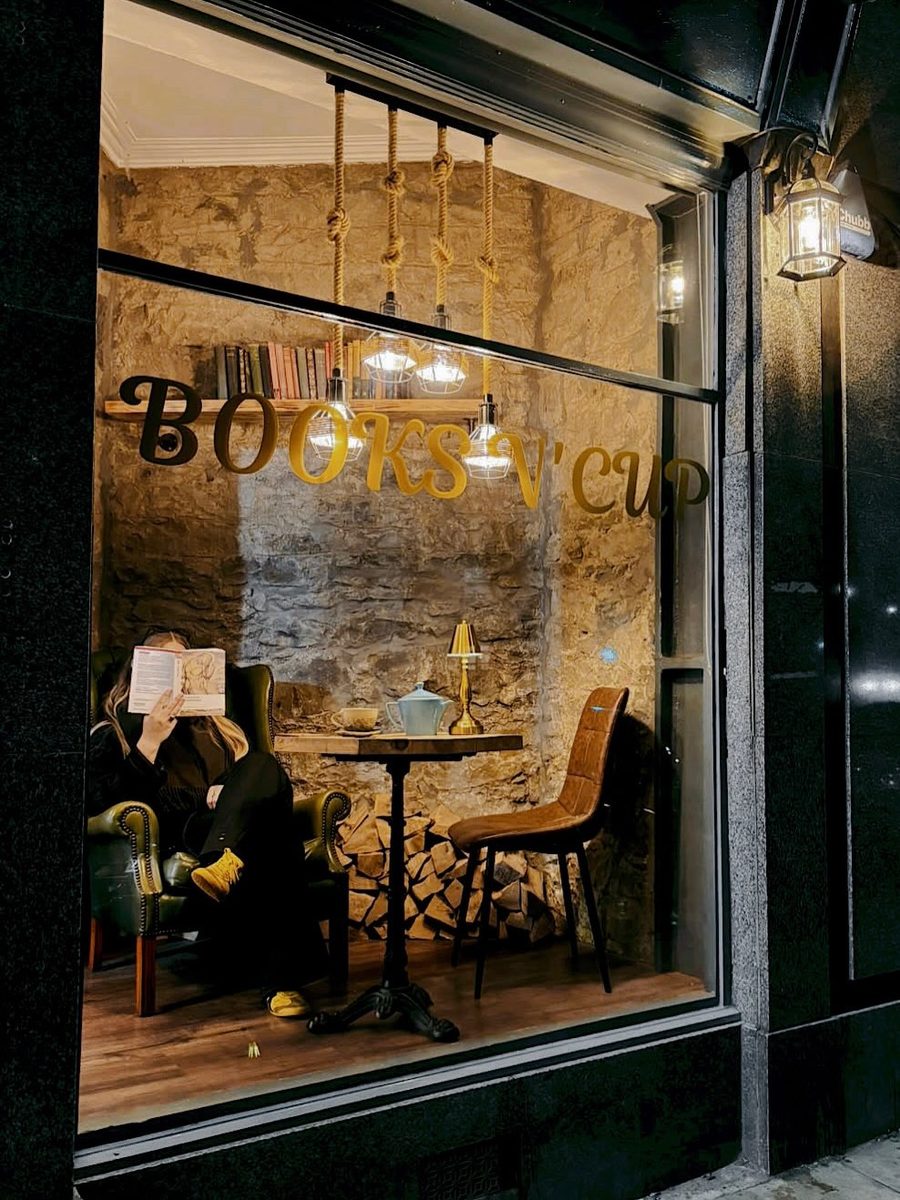 Through the window — stone walls and a quiet reader